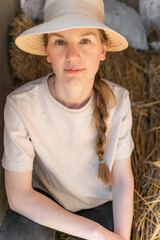 Young woman Embracing Rural Lifestyle in Rustic Barn Setting