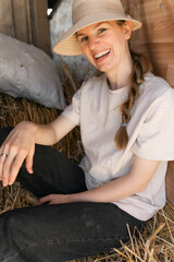 Young woman Embracing Rural Lifestyle in Rustic Barn Setting