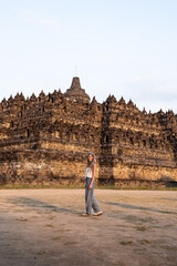 Tourist woman walking at candi borobudur temple in java, indonesia