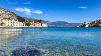 Clear Blue Sea And Colorful Waterfront Houses In Kastellorizo Island, Greece, On A Bright Sunny Day, Concept Of Coastal Escape, Summer Vacation, Travel Inspiration, Seaside Living, Sustainable Tourism