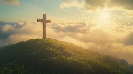 Wooden cross atop a hill bathed in golden light.