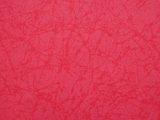 Red paper background with beautiful line patterns. The color is rich and consistent perfect for love cards and messages, crafts..