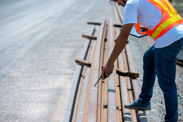 Construction Site Inspector: A construction worker in safety gear conducts a meticulous inspection...