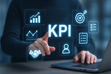 Naklejka premium KPI Insight: A focused professional interacts with a digital display visualizing Key Performance Indicators, illustrating a data-driven approach to business success.