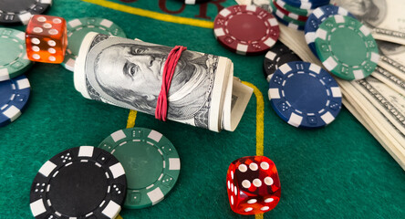 Poker chips and dollar Money bills on green cloth