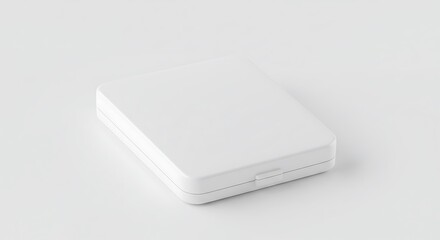 Small White Box Lying Flat on a Light Surface