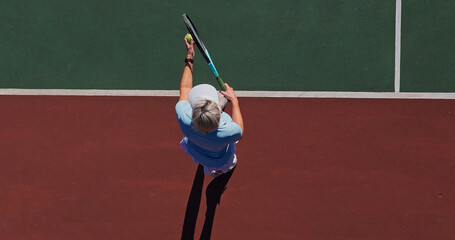 Start, serve and woman on outdoor tennis court with challenge, performance and game from above. Racket, ball and professional athlete at lines for fitness, wellness and competition at sports club