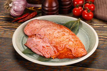 Raw marinated duck breast for cooking