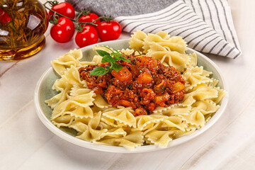 Italian pasta Farfalle Bolognese with meat