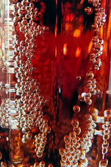 Processed collage of golden yellow drink bubbles texture. Background for banner, backdrop or texture. Vertical photo.