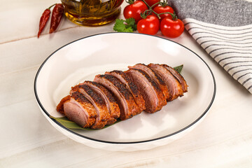 Sliced duck breast baked with cherry