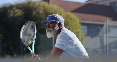Tennis, serve and training with senior black man on court for sports tournament, competition and game. Start, exercise and championship with elderly person in outdoors for athlete, fitness and event