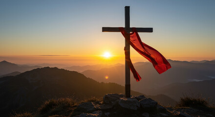 Cross with red cloth on mountain summit at sunrise. Christian faith symbol. Religious pilgrimage destination. Spiritual journey. Easter celebration. Holy week commemoration. Good Friday. Horizontal