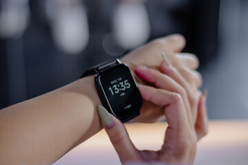 Smartwatch Displaying Information on a Woman's Wrist in a Modern