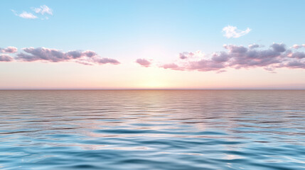 Obraz premium Calm sea at sunset with soft clouds reflecting warm colors in sky