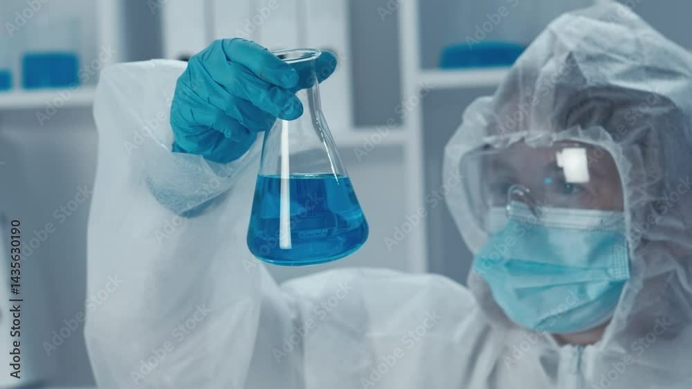 Poster in a stateoftheart lab, a dedicated scientist in protective gear examines a glass flask with a vibra