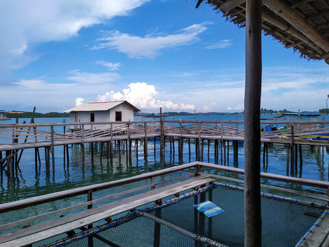 Coastal water village scene with wooden platforms, Batam, Indonesia. 