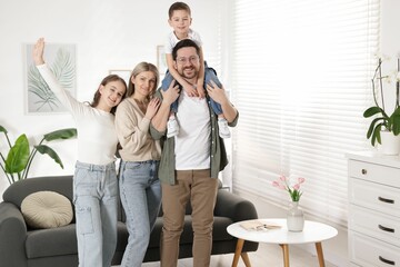 Portrait of happy parents with their kids at home