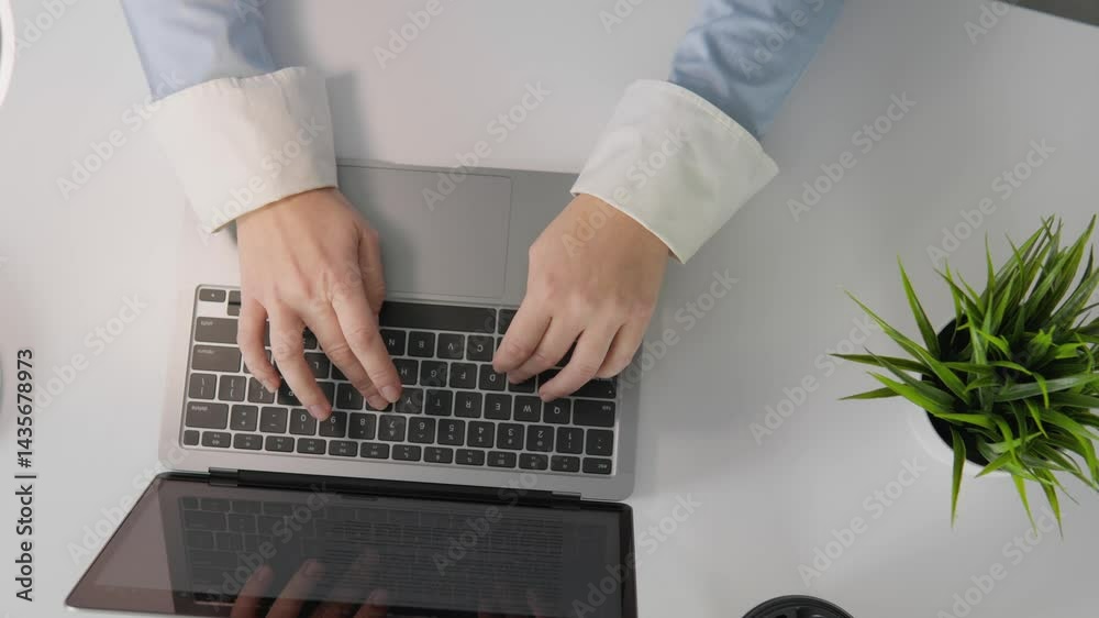 Poster this image shows hands typing on a sleek laptop, highlighting productivity in a stylish office with 