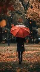 Solitary figure, red umbrella, autumn leaves, rain.