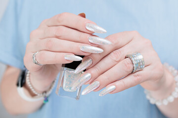 beautiful female hands with long nails light white manicure
