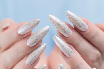 beautiful female hands with long nails light white manicure