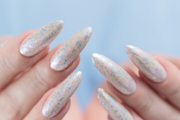beautiful female hands with long nails light white manicure