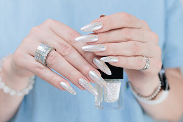 beautiful female hands with long nails light white manicure