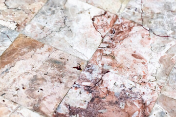 Marble tiles in a close-up view, showcasing detailed natural patterns