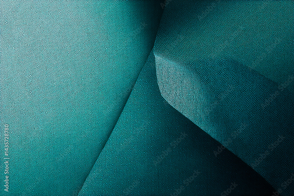 Poster teal textured surface, folded creating shadow and depth, evokes elegance, sophistication, and modern
