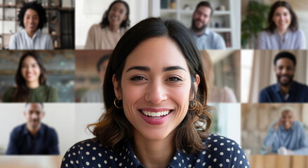 Smiling woman in a video conference with diverse colleagues, showcasing virtual teamwork and communication