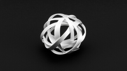 A white abstract sculpture against a black background.