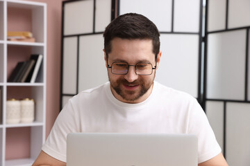 Online speaker streaming webinar with laptop indoors