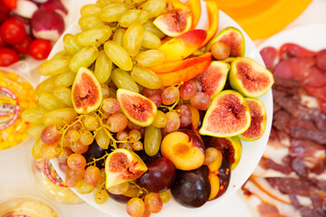 Plate with assorted fruits.