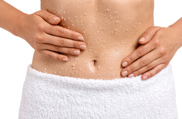 Woman applying body scrub onto her belly against white background, closeup