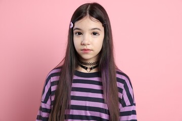 Fototapeta premium Teenage girl in stylish clothes posing on pink background. Makeup in anime style