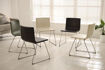 Chairs in circle prepared for group psychotherapy session indoors
