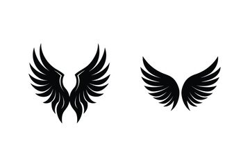 Two Sets Of Black Angel Wings On An Isolated White Background