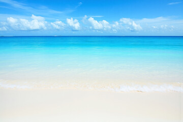 sandy beach with a blue sky and white clouds