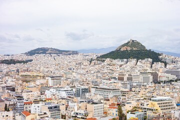 Cityscape of Athens city in Greece with Lycabettus and Tourkobounia Hill