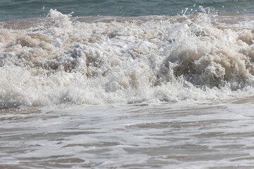 The ocean is rough and the waves are high