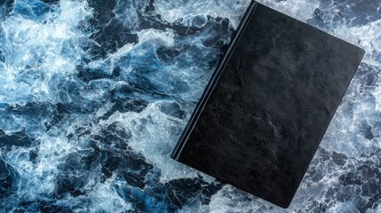 A book with a black cover and white text.