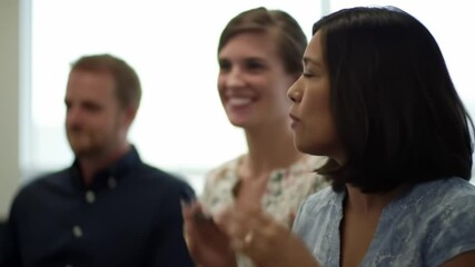 Participants engage in a discussion about collaboration and workplace dynamics in a contemporary office environment. They share insights and strategies for effective teamwork to enhance productivity.