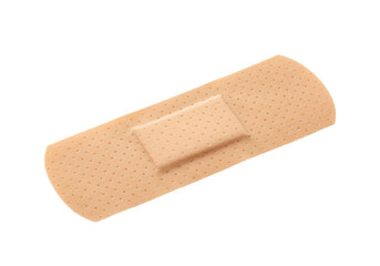 Adhesive bandage on a surface, first aid for cuts and scrapes, isolated shot