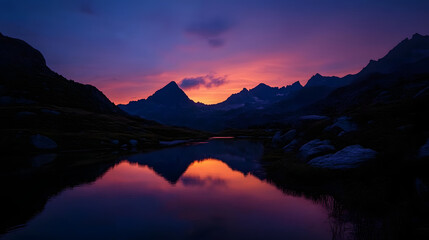 Fototapeta premium A breathtaking view of a mountain sunset, with the sky glowing in a myriad of colors over a tranquil alpine lake.