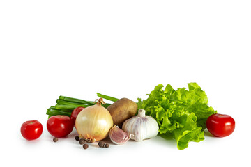 Green onion, radish, lettuce, tomatoes, garlic and potatoes isolated on white background.