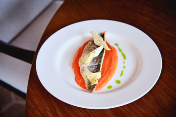 fish with sauce on a plate