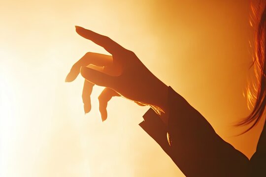 Silhouette of hand reaching