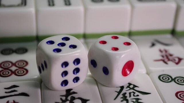 Close-up of Mahjong tile set,Mahjong is a tile-based game from 19th-century China that has gained global popularity since the early 20th century,4k,slow-motion,truck camera movements