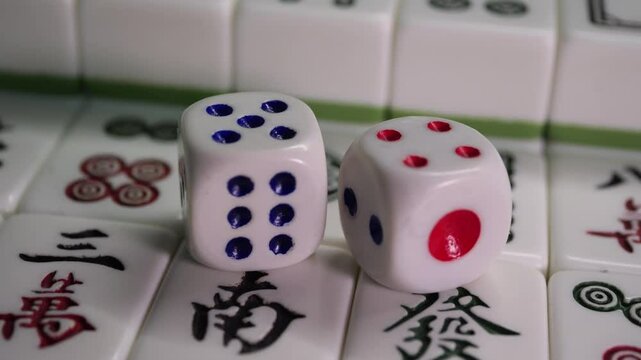 Close-up of Mahjong tile set,Mahjong is a tile-based game from 19th-century China that has gained global popularity since the early 20th century,4k,slow-motion,truck camera movements